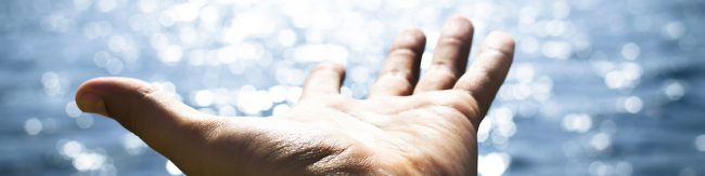 Man feeling freedom on open sea
